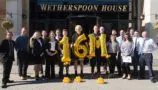 Staff from J D Wetherspoon celebrate raising £16million for CLIC Sargent