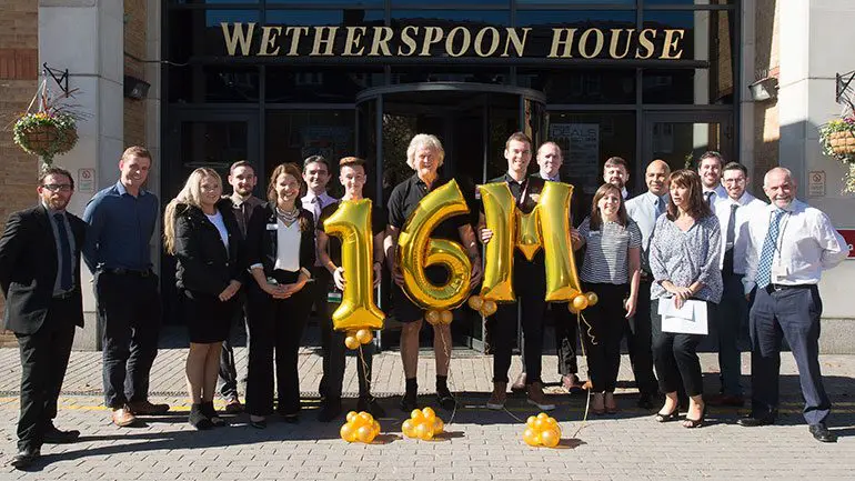 Staff from J D Wetherspoon celebrate raising £16million for CLIC Sargent